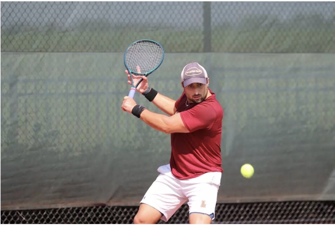 Spencer hitting backhand
